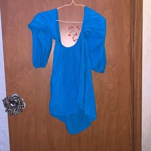 Blue Evening shirt. Girls Small. From the brand Elan. Not as small as it looks.